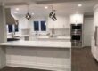 Modern white kitchen with island and pendant lights