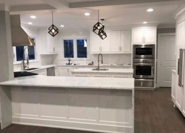 Modern white kitchen with island and pendant lights