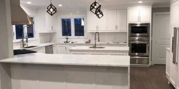 Modern white kitchen with island and pendant lights