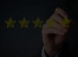Hand drawing four yellow stars